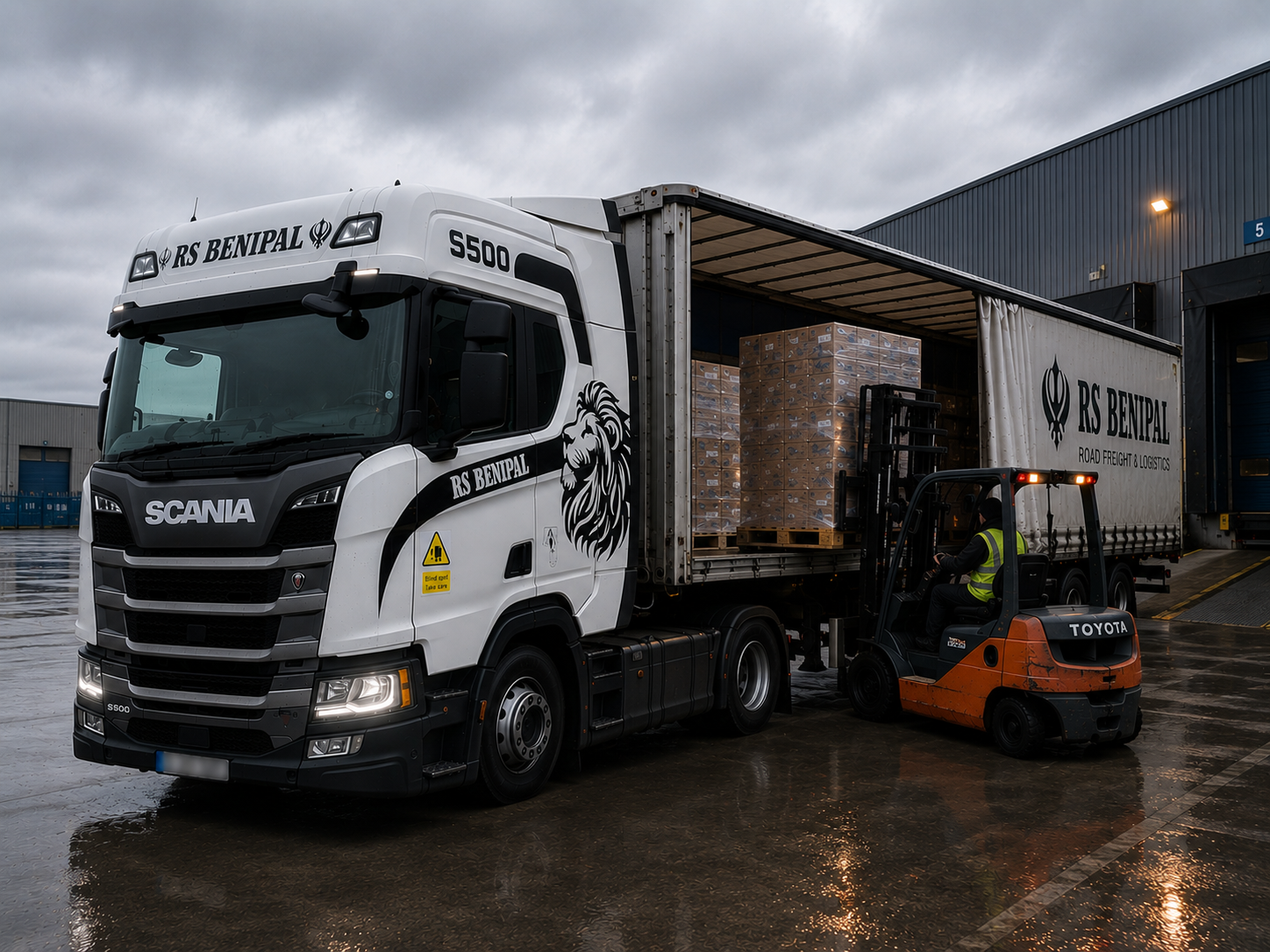 Commercial freight being loaded into a trailer